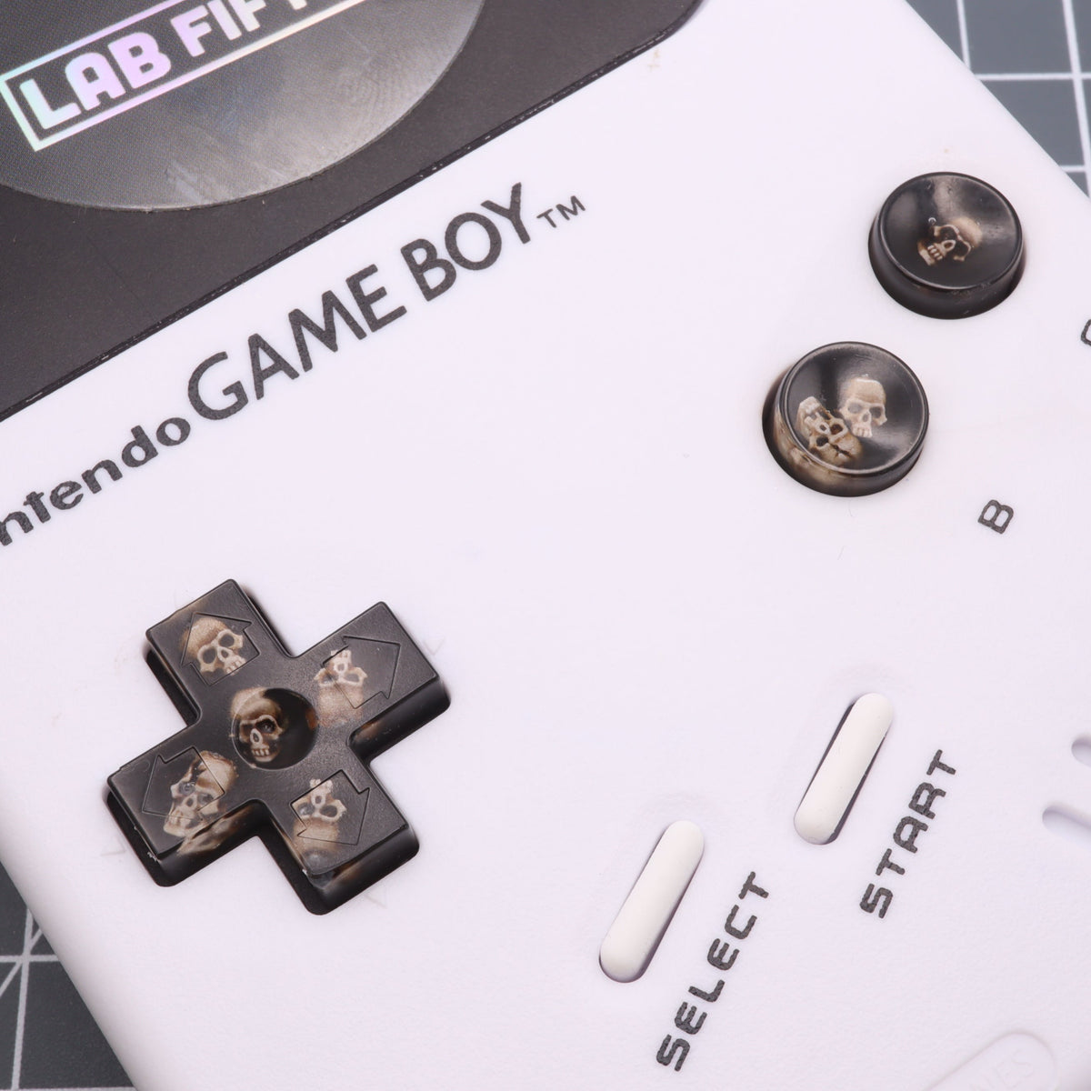 Hand cast custom resin buttons for Nintendo NES controller NES-004 (also fits Game Boy DMG-01) - Skull | Lab Fifteen Co