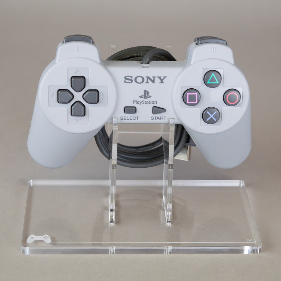 Display stand for Sony PS1 controller - Crystal Clear [Playstation 1] | Rose Colored Gaming