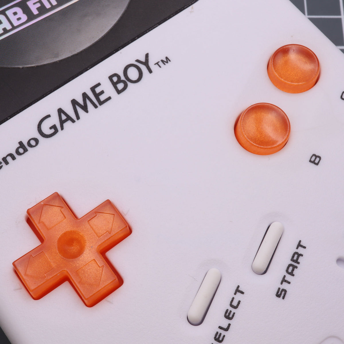 Hand cast custom resin buttons for Nintendo NES controller NES-004 (also fits Game Boy DMG-01) - Orange Candy | Lab Fifteen Co