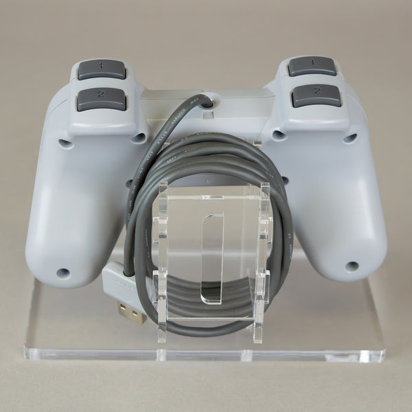 Display stand for Sony PS1 controller - Crystal Clear [Playstation 1] | Rose Colored Gaming