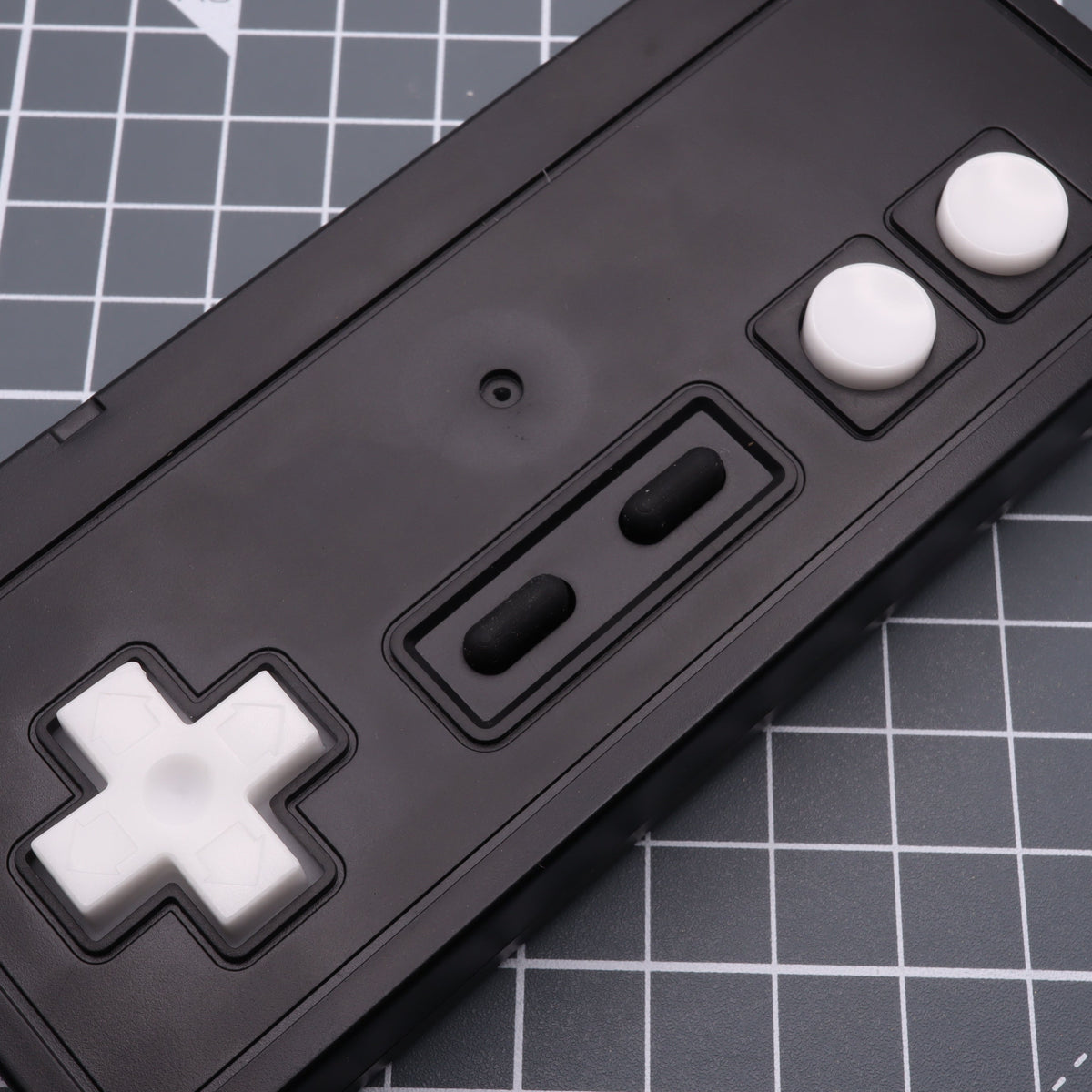 Hand cast custom resin buttons for Nintendo NES controller NES-004 (also fits Game Boy DMG-01) - Glow in the Dark Blue | Lab Fifteen Co