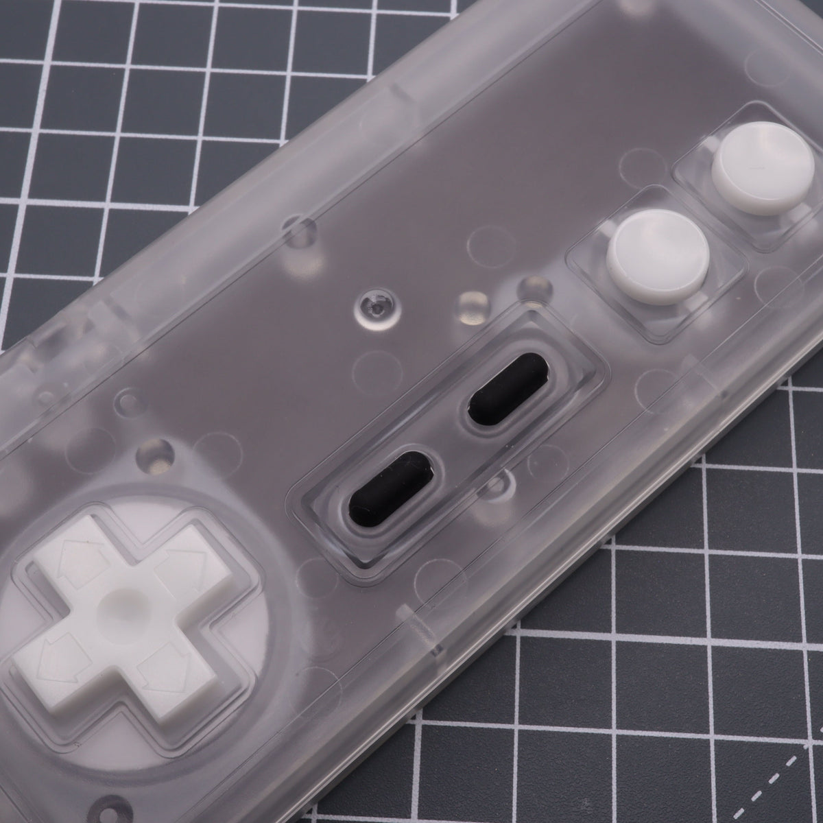 Hand cast custom resin buttons for Nintendo NES controller NES-004 (also fits Game Boy DMG-01) - Glow in the Dark Aqua | Lab Fifteen Co