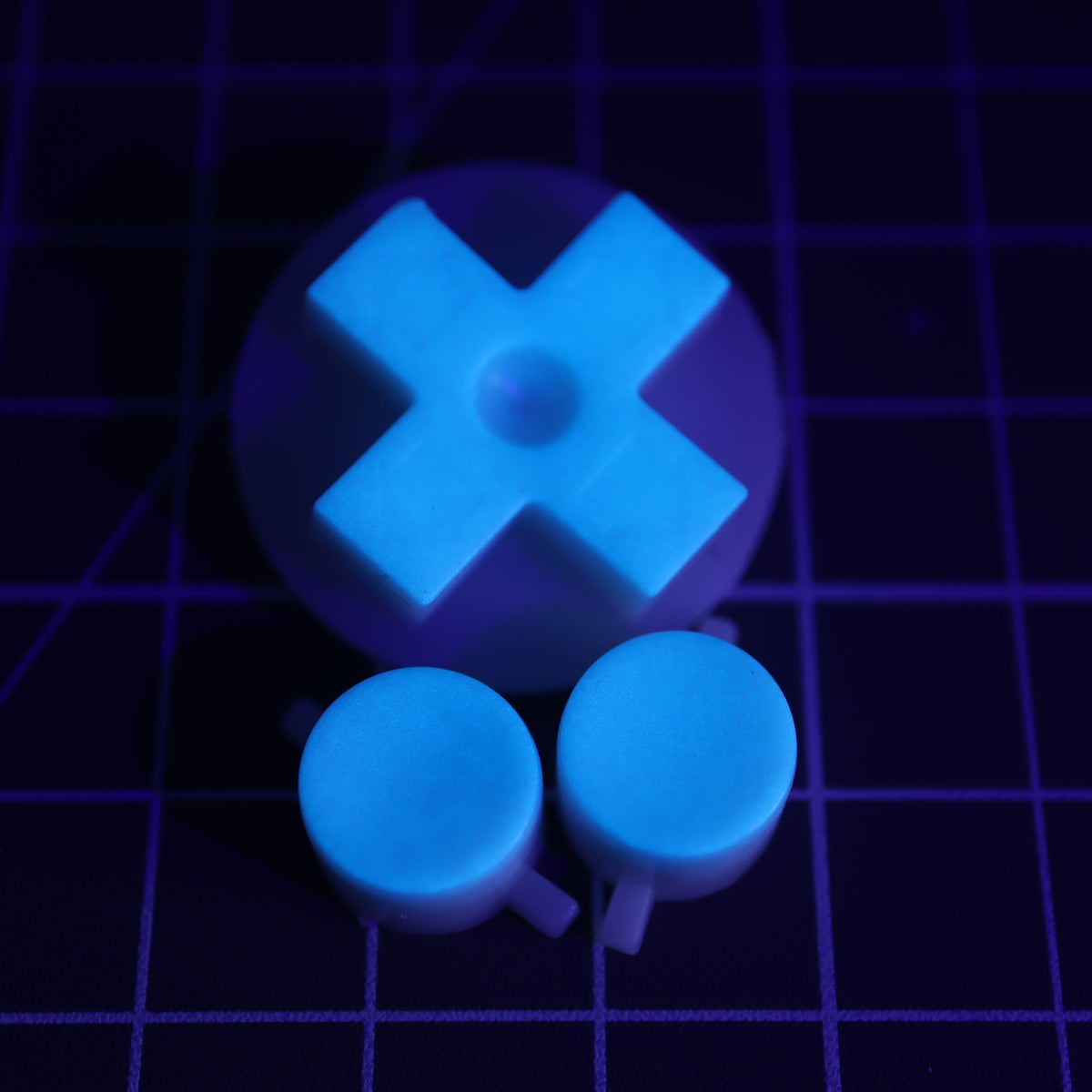 Hand cast custom resin buttons for Nintendo NES controller NES-004 (also fits Game Boy DMG-01) - Glow in the Dark Blue | Lab Fifteen Co
