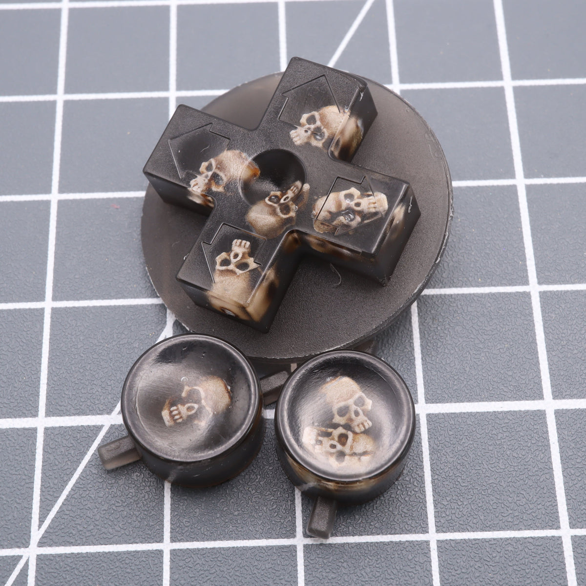 Hand cast custom resin buttons for Nintendo NES controller NES-004 (also fits Game Boy DMG-01) - Skull | Lab Fifteen Co