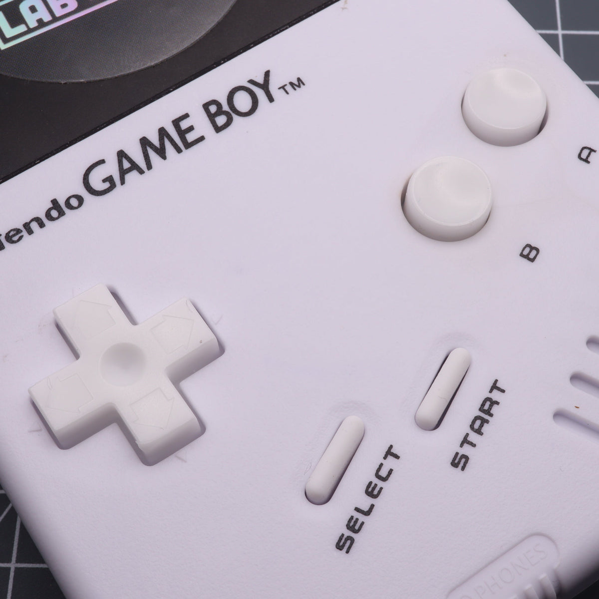 Hand cast custom resin buttons for Nintendo NES controller NES-004 (also fits Game Boy DMG-01) - Glow in the Dark Blue | Lab Fifteen Co