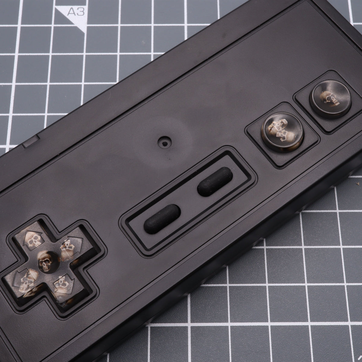Hand cast custom resin buttons for Nintendo NES controller NES-004 (also fits Game Boy DMG-01) - Skull | Lab Fifteen Co