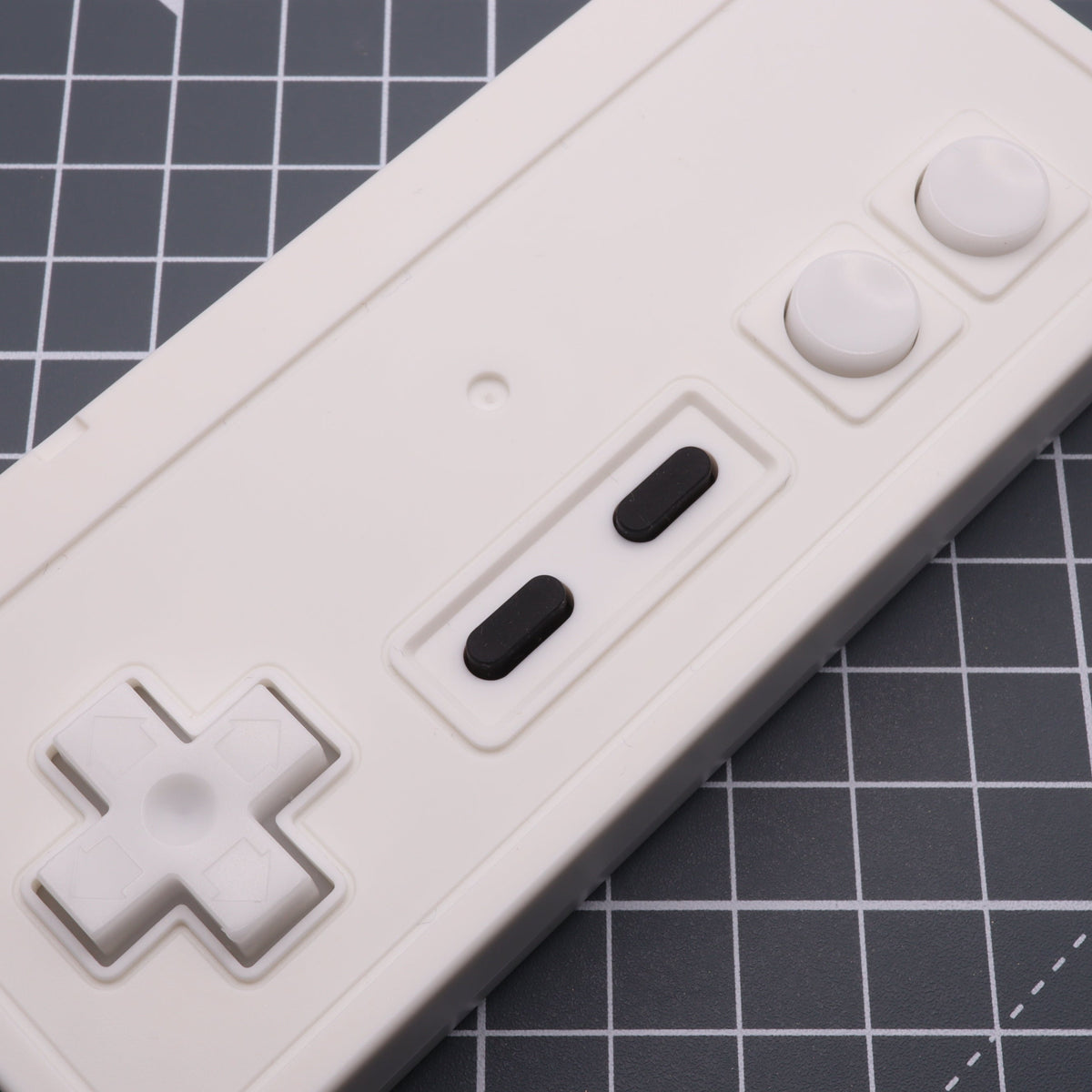 Hand cast custom resin buttons for Nintendo NES controller NES-004 (also fits Game Boy DMG-01) - Glow in the Dark Blue | Lab Fifteen Co