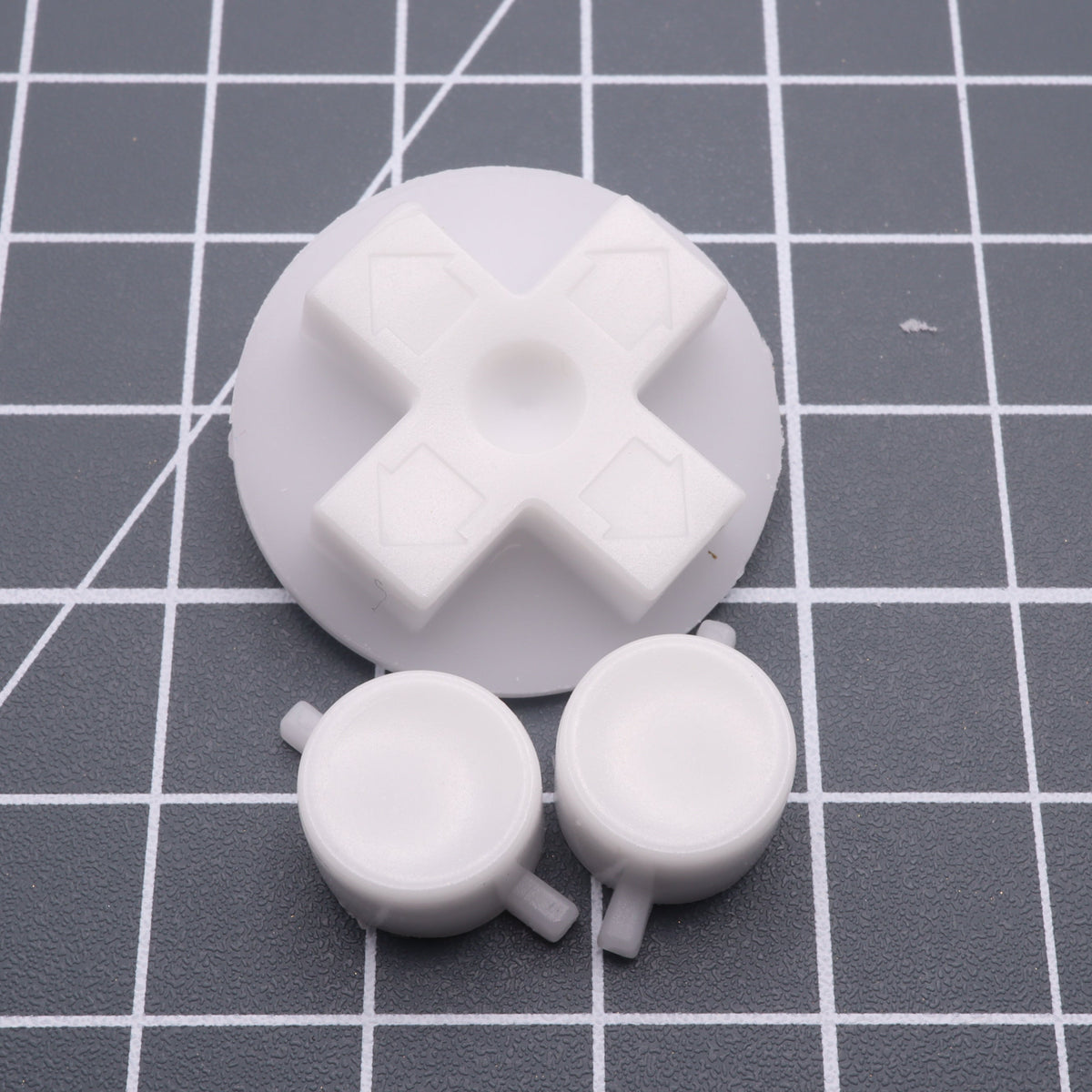 Hand cast custom resin buttons for Nintendo NES controller NES-004 (also fits Game Boy DMG-01) - Glow in the Dark Blue | Lab Fifteen Co