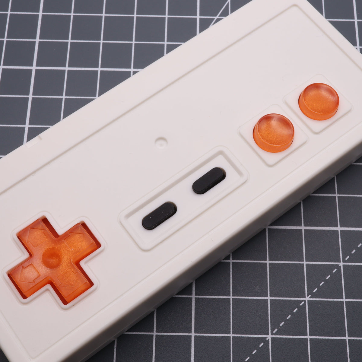 Hand cast custom resin buttons for Nintendo NES controller NES-004 (also fits Game Boy DMG-01) - Orange Candy | Lab Fifteen Co
