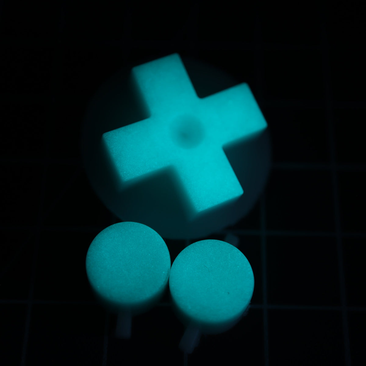 Hand cast custom resin buttons for Nintendo NES controller NES-004 (also fits Game Boy DMG-01) - Glow in the Dark Aqua | Lab Fifteen Co