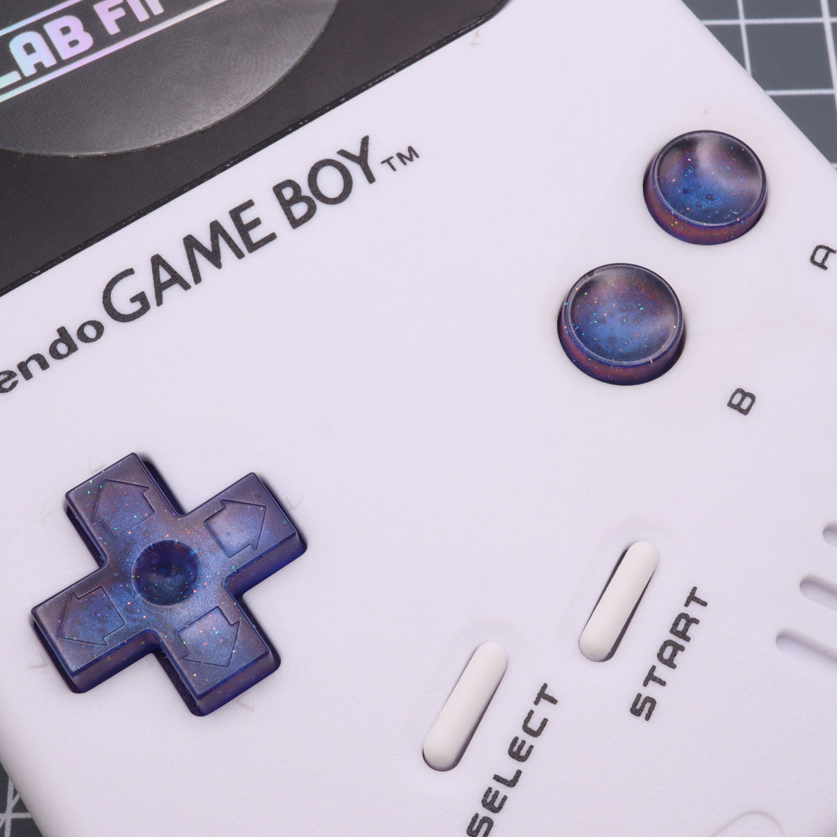 Hand cast custom resin buttons for Nintendo NES controller NES-004 (also fits Game Boy DMG-01) - Cosmic Blue | Lab Fifteen Co