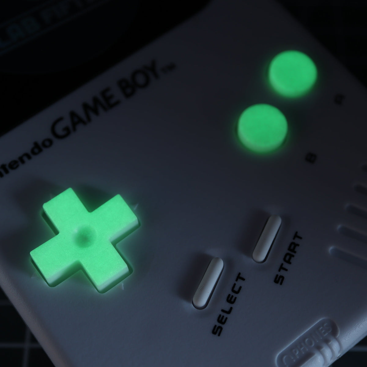 Hand cast custom resin buttons for Nintendo NES controller NES-004 (also fits Game Boy DMG-01) - Glow in the Dark Green | Lab Fifteen Co