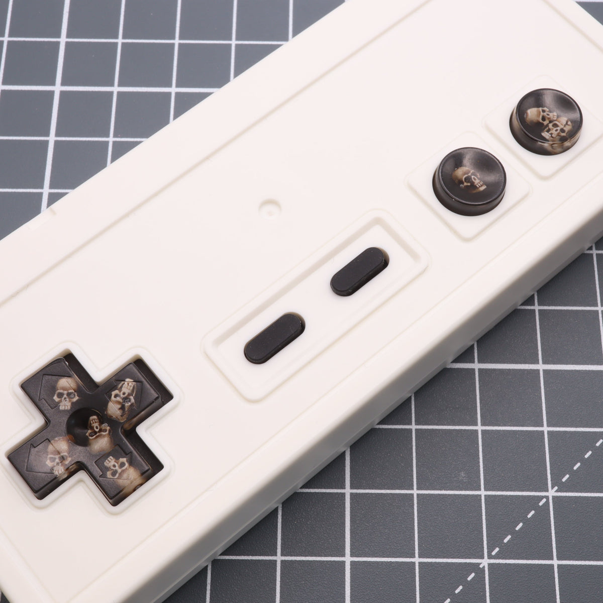 Hand cast custom resin buttons for Nintendo NES controller NES-004 (also fits Game Boy DMG-01) - Skull | Lab Fifteen Co