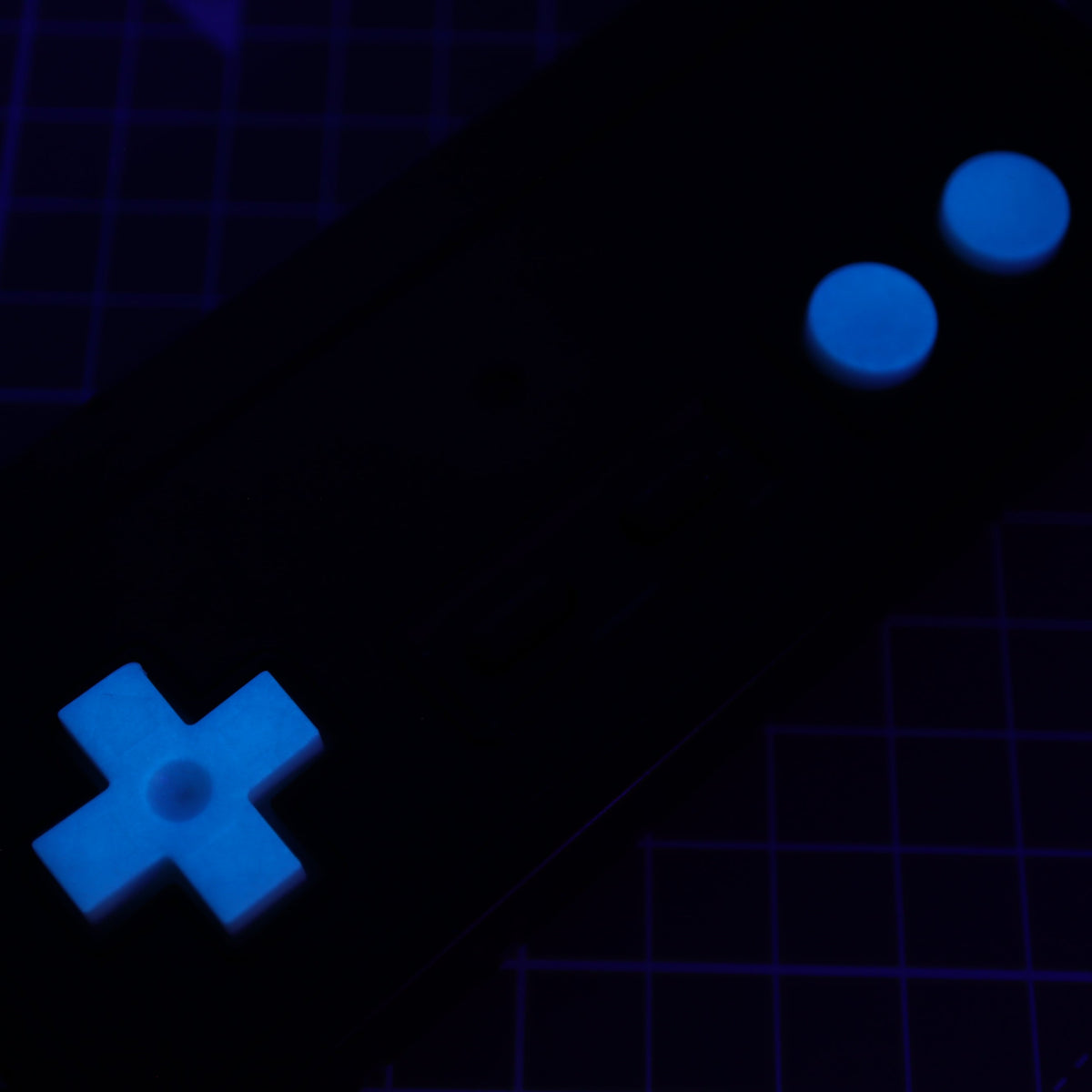 Hand cast custom resin buttons for Nintendo NES controller NES-004 (also fits Game Boy DMG-01) - Glow in the Dark Blue | Lab Fifteen Co