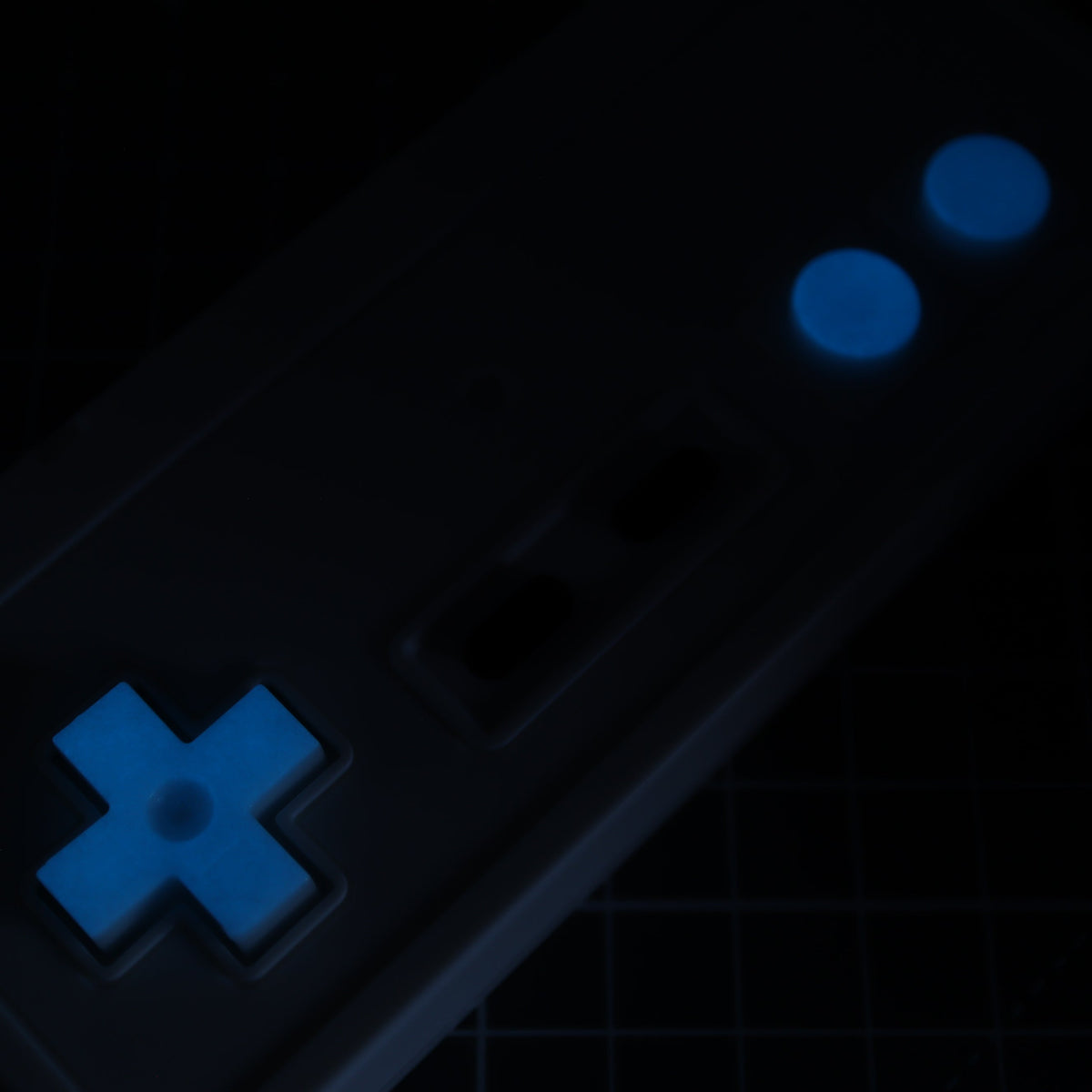 Hand cast custom resin buttons for Nintendo NES controller NES-004 (also fits Game Boy DMG-01) - Glow in the Dark Blue | Lab Fifteen Co
