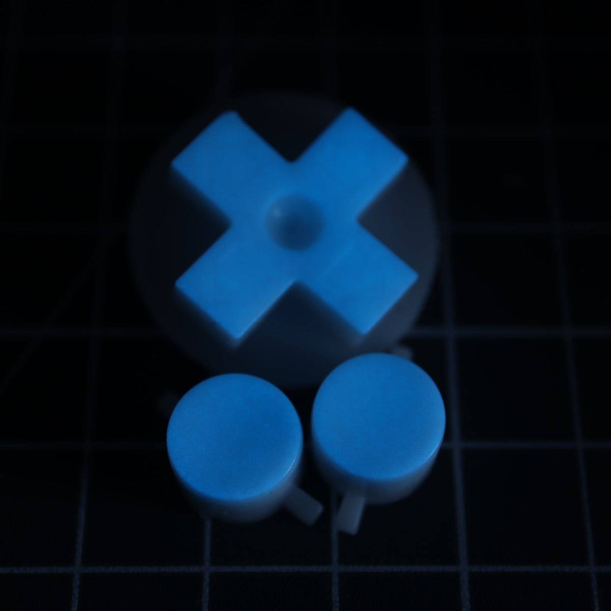 Hand cast custom resin buttons for Nintendo NES controller NES-004 (also fits Game Boy DMG-01) - Glow in the Dark Blue | Lab Fifteen Co