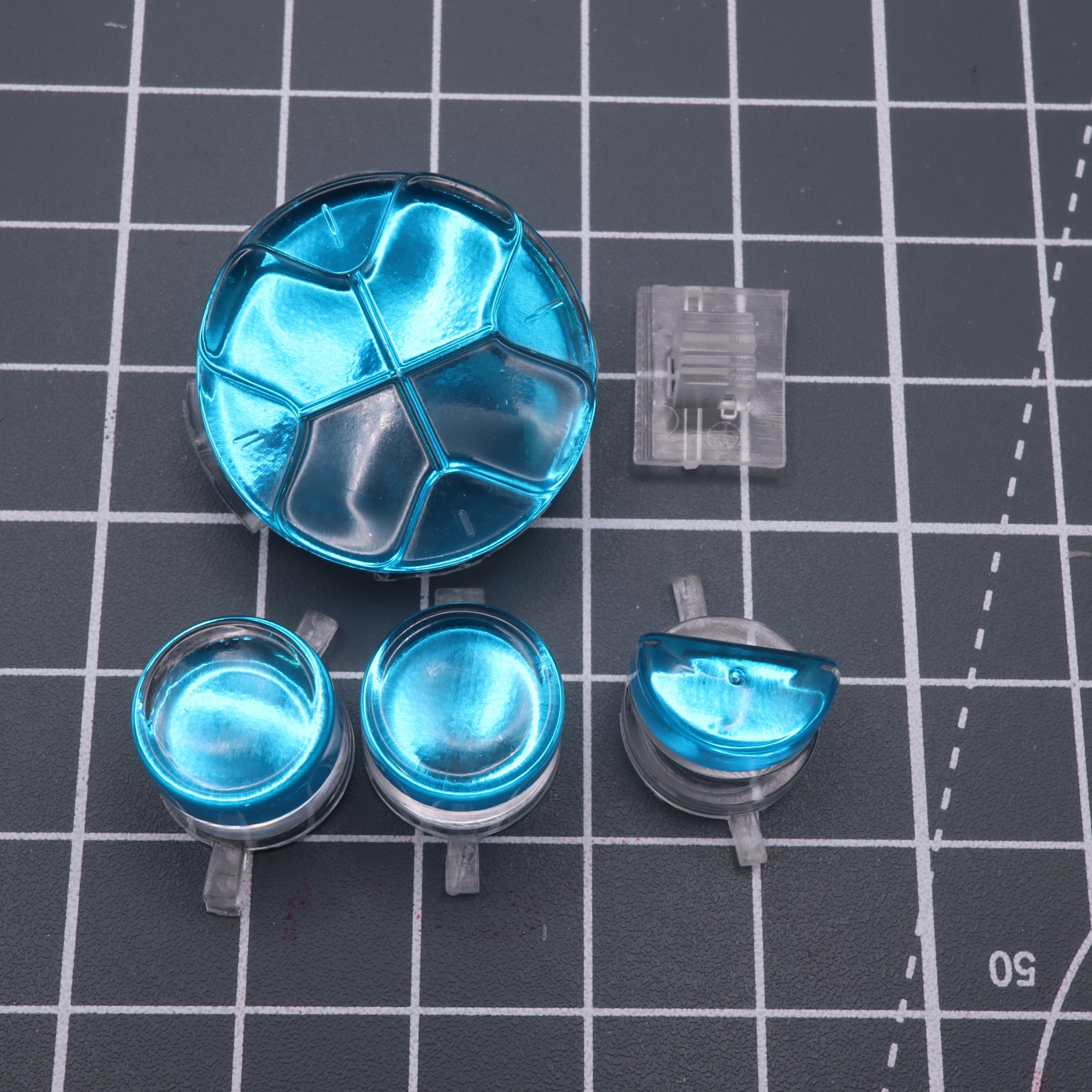 Hand cast custom resin buttons for Sega Game Gear - Chrome blue | Lab Fifteen Co