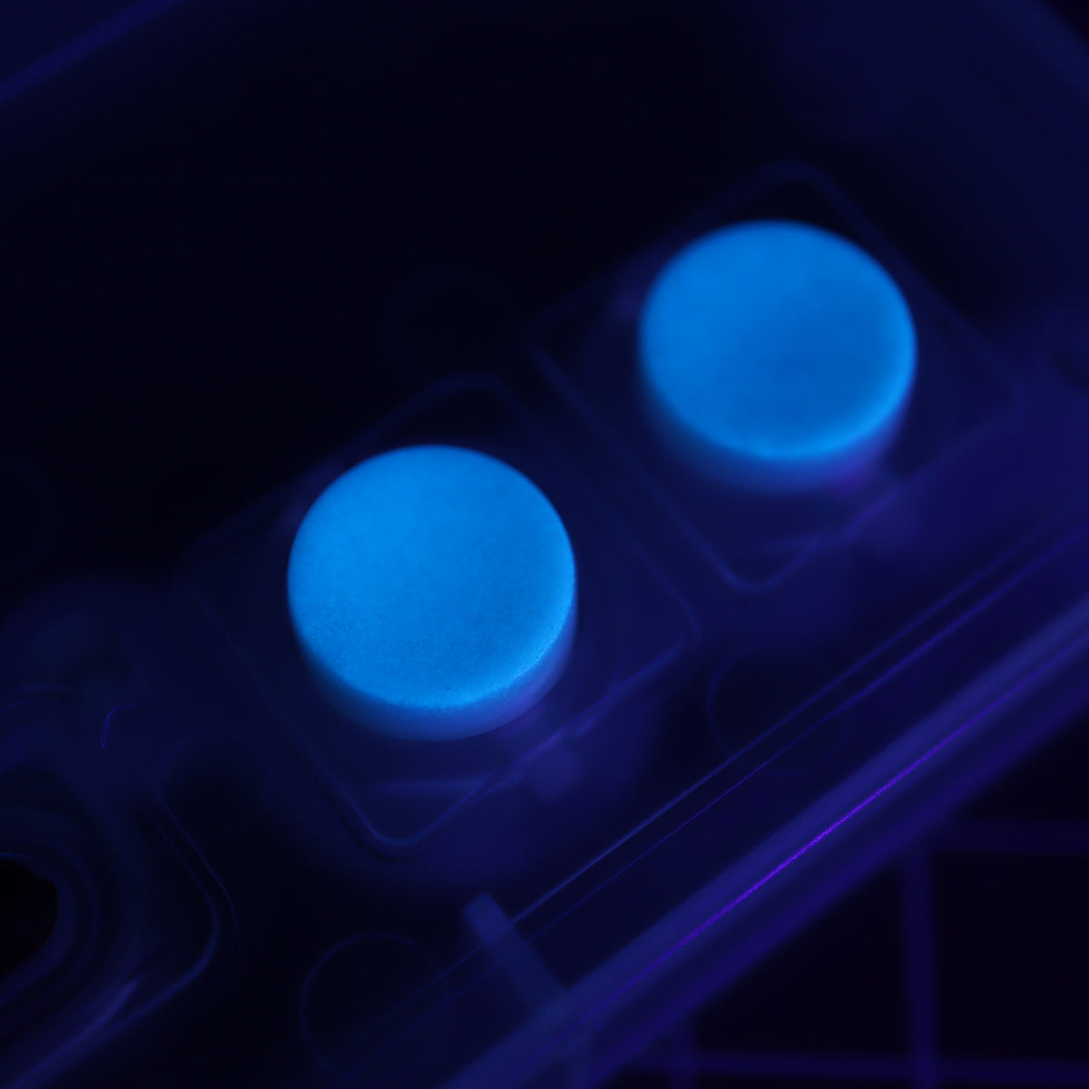 Hand cast custom resin buttons for Nintendo NES controller NES-004 (also fits Game Boy DMG-01) - Glow in the Dark Blue | Lab Fifteen Co