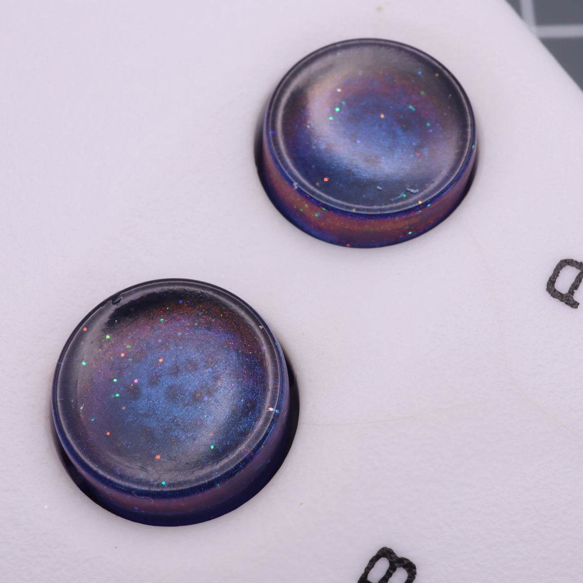 Hand cast custom resin buttons for Nintendo NES controller NES-004 (also fits Game Boy DMG-01) - Cosmic Blue | Lab Fifteen Co