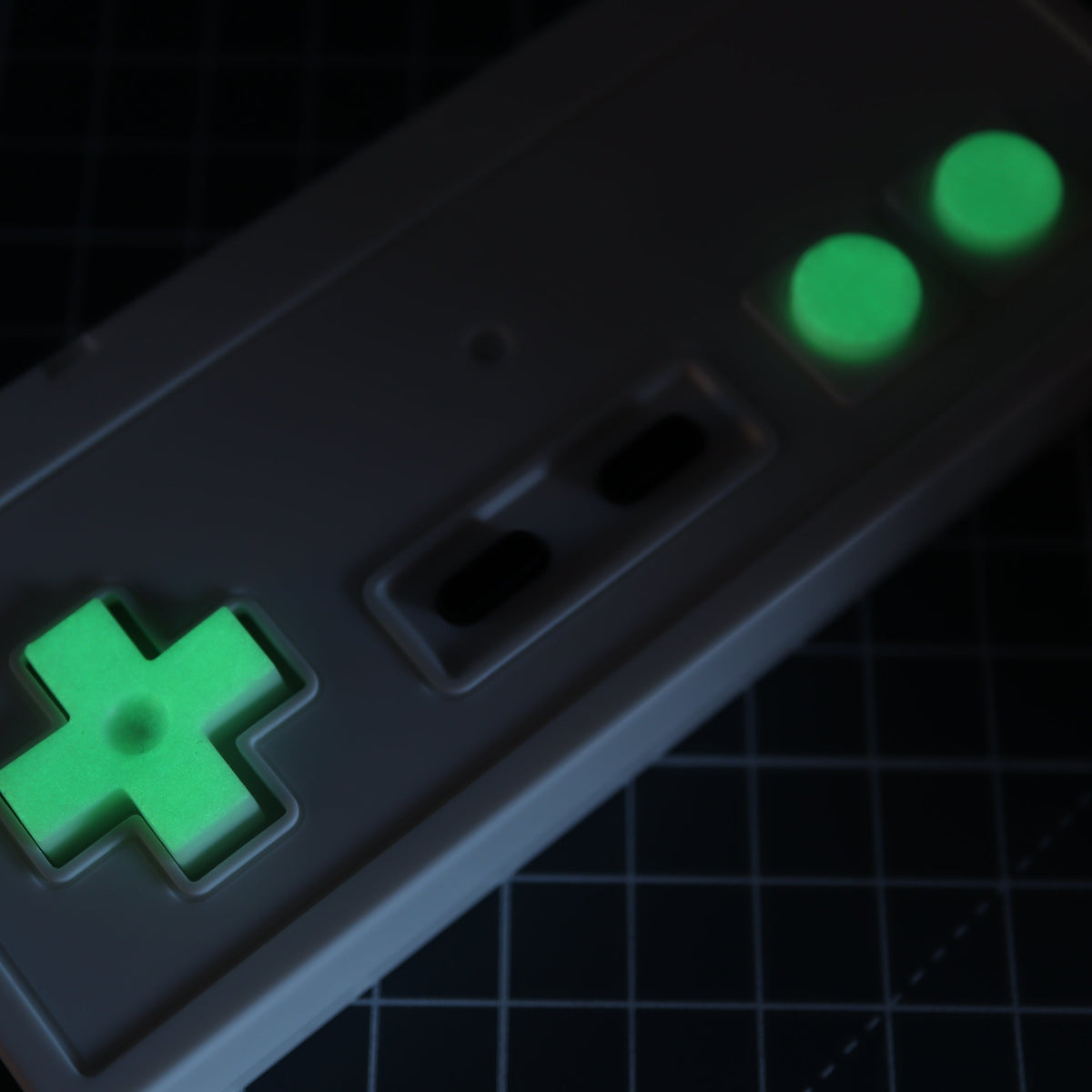Hand cast custom resin buttons for Nintendo NES controller NES-004 (also fits Game Boy DMG-01) - Glow in the Dark Green | Lab Fifteen Co